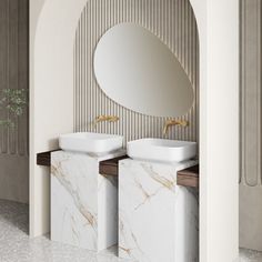 two white sinks sitting next to each other in a bathroom under a round mirror on the wall