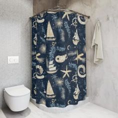 a bathroom with a blue shower curtain next to a toilet