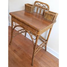 two wicker baskets sit on top of a wooden table