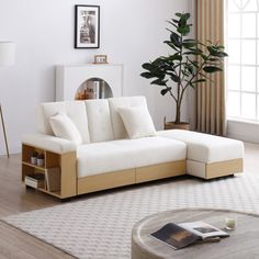 a living room with a white couch and coffee table