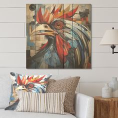 a living room scene with focus on the rooster artwork