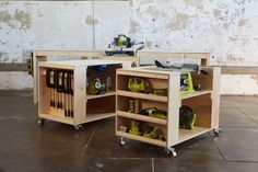 two wooden cabinets with tools in them on wheels