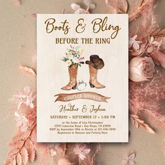 boots and rings before the ring bridal party card with pink flowers on it, surrounded by feathers