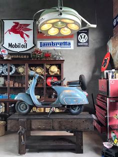 an old scooter is on display in a shop