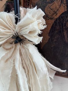 a white cloth bag sitting on top of a table