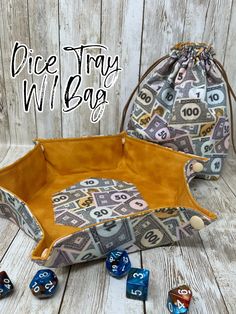 two dice bags with numbers on them and the words dice tray written in large letters