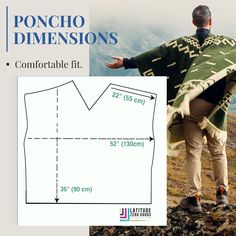 a man standing on top of a mountain wearing a poncho