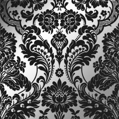 black and white damask wallpaper with an intricate floral design on it's side