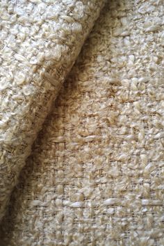 close up view of the textured fabric on a bed sheet that has been made from natural materials