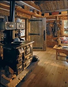 an old fashioned stove in a rustic cabin