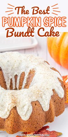 the best pumpkin spice bundt cake with white frosting on top and an orange pumpkin in the background