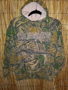 Cabela's hoodie camouflage 3D long sleeve Cabela's spelled out and raised "World's Legendary Outfitters" 21.5 inch armpit to armpit  Good condition lovingly worn-- nice and soft lots of wear left.... TT Army Fatigue Jacket, Army Fatigue, Raised Letters, Green Hoodie, Hoodie Jacket, Nike Jacket, Camouflage, Camo, Hunting