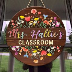 a wooden sign that says mrs hale's classroom hanging from the side of a window