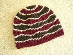 a crocheted hat laying on the floor