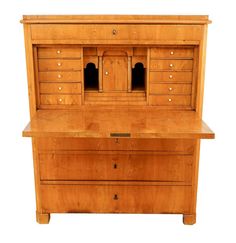 an old fashioned wooden desk with drawers