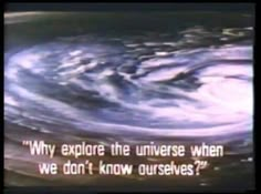 a television screen with the words, why explore the universe when we don't know ourselves?