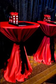 two red table cloths with candles on them