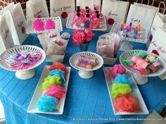 the table is set up with paper bags and other items for party guests to enjoy