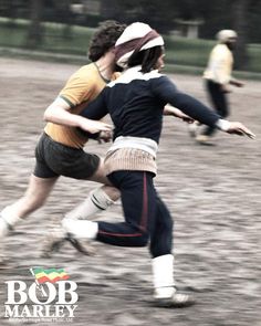 two people are playing frisbee in the mud