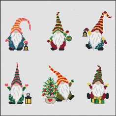 cross stitch gnomes with christmas trees and gifts in their hands, all wearing colorful hats