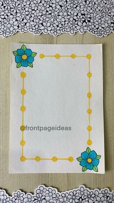 a piece of paper with blue flowers on it next to a lace doily border