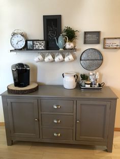 there is a coffee maker on top of the dresser