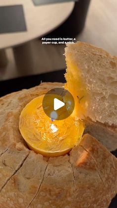 a piece of bread with an egg in it and a slice cut out to show the inside