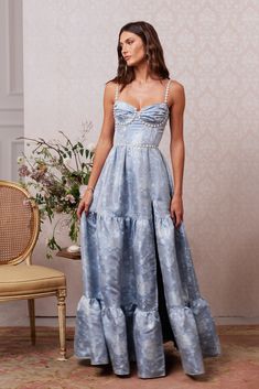 Introducing The Lucetta Dress! She's a dreamy corset gown featuring beautifully gathered cups, pearl and crystal beaded trim, and gathered skirt tiers. She flaunts a side-front slit, invisible zipper, and side-pockets! She's made from our Denim Blue Windsor brocade, which features blue florals on a blue background. She's elegant, sophisticated, and a timeless treasure. If you are in between sizes, we recommend sizing up in this dress. Kyla is 5’9.5 and is wearing a size 0. Please note color shad Windsor Dress, Prom Dress Inspo, Corset Gown, Blue Florals, Guest Attire, Blue Gown, Wedding Attire Guest, Windsor Dresses, Prom Outfits