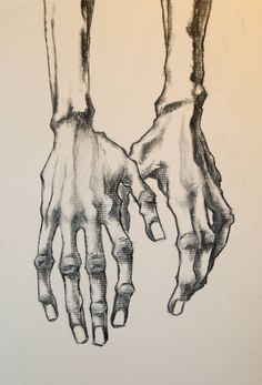 two hands holding each other with their fingers