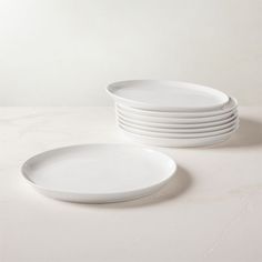 white plates stacked on top of each other