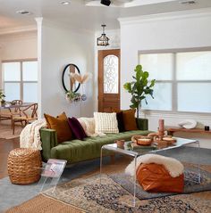 a living room filled with furniture and lots of windows