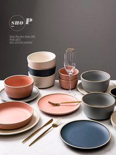 a table topped with lots of plates and bowls