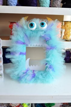 a close up of a stuffed animal on a shelf