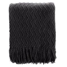 a black and grey blanket with fringes on the bottom, against a white background