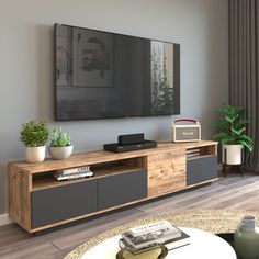 a flat screen tv mounted to the side of a wooden entertainment center in a living room