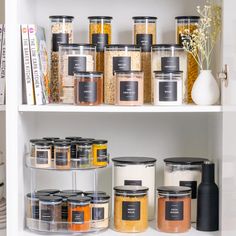 the shelves are filled with various types of spices