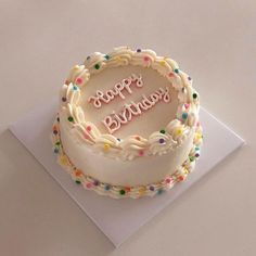 a birthday cake with the words happy birthday written on it