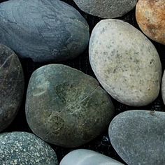 several different colored rocks sitting next to each other