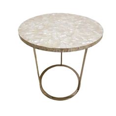 a round table with a metal base and white mother of pearl on the top, against a white background