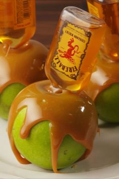 apples covered in caramel and apple cider drizzled with liquid