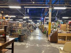 the inside of a store with lots of furniture