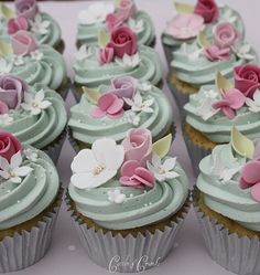 cupcakes with frosting and flowers on them