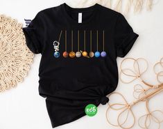 ✨ DISCOUNT: 🎁 2 items: Enjoy a 35% discount with code BUYMEW35 🎁 5 items: Enjoy a 40% discount with code BUYMEW40 🎁 More than 10 items: Enjoy a 45% discount with code BUYMEW45 So why wait? Add our Astronomy Tee to your cart and blast off on a laughter-filled adventure through the cosmos! Whether you're a seasoned astronomer or a space enthusiast, this galaxy shirt is sure to impress. 🌌🛍️ LISTING FOR ✨ Unisex Jersey Short Sleeve Tee Bella+Canvas 3001, Solid colors are 100% cotton, heather co Cute Astronaut, Galaxy Shirt, Space Gift, Solar System, Astronomy, Different Styles, Planets, Hooded Sweatshirts, No Response