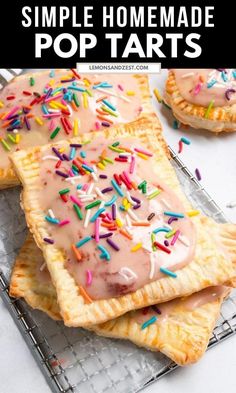 homemade pop tarts with frosting and sprinkles on top, sitting on a cooling rack