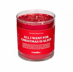 a red candle with the words all i want for christmas is sleep