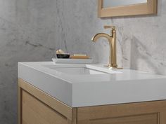 a bathroom sink with a toothbrush and soap dispenser on the counter