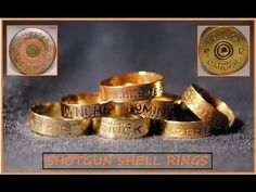 five gold rings with words written on them and a coin in the background that says, shotgun shell rings