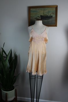 "Vintage silk step ins from the 1930s-40s. Estimated size S. Please see measurements for accurate fit. Measurements (taken laid flat, doubled where necessary): Length: 26.5\" Chest: 34\" Waist: 32\" Hips: 40\" Inseam: 2\" Condition: Good vintage condition for age. Some wear noted on lace and straps (pictured). No other notable signs of wear. Mannequin is a size S and measures 34\",27\",34\". Thank you for visiting Bug B. v i s i t t h e s h o p www.BugBVintage.etsy.com" Vintage Silk Slip Dress For Wedding Night, Vintage Beige Sleepwear For Loungewear, Vintage V-neck Slip Dress With Lace Trim, Vintage Sleeveless Slip Dress For Loungewear, Vintage V-neck Lace Trim Slip Dress, Fitted Vintage Sleepwear With Lace Trim, Fitted Vintage Sleepwear, Vintage Cream Sleepwear For Loungewear, Vintage Summer Sleepwear