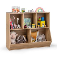 a wooden shelf filled with stuffed animals and toys