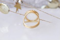 WHITE OPAL RING, Big Stone Ring, October Birthstone Jewelry, Ring With Gemstone, Gold Filled Ring, Anniversary Ring, Opal Statement Ring . Details of item: Metal: 14k gold filled Gemstone: white opal OR light blue stone Front Size: 16 mm Available all size us The ring will be packed in a gift box. , FOR MATCHING EARRINGS HERE: https://www.etsy.com/il-en/listing/271149965/white-opal-gold-earrings-for-bride?ga_search_query=FIRE+OPAL+EARRINGS&ref=shop_items_search_21 FOR ALL OPAL RING HERE: htt White Moonstone Open Ring Jewelry, White Gemstone Open Ring, White Moonstone Open Ring, White Open Ring With Ring Detail, Elegant White Moonstone Round Ring, Elegant White Round Moonstone Ring, Elegant White Moonstone Ring, White Crystal Promise Ring With Stone Setting, White Moonstone Open Ring With Gemstone